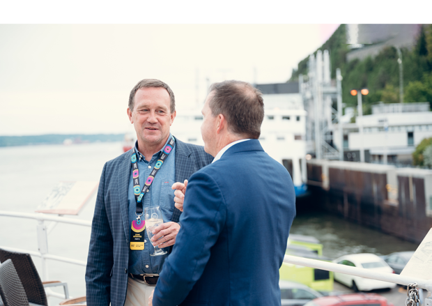 Two men talking on a dock