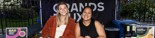 Two young women volunteers smiling for the photo